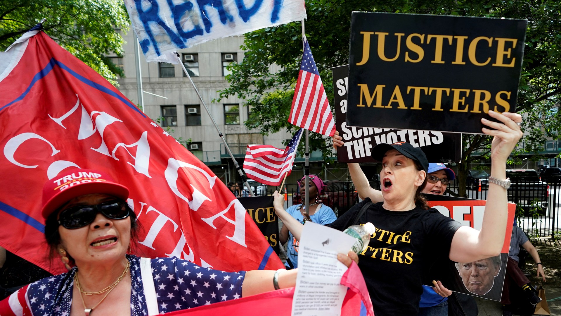 Supporters and opponents of former US president Donald Trump outside the Manhattan Criminal Court.