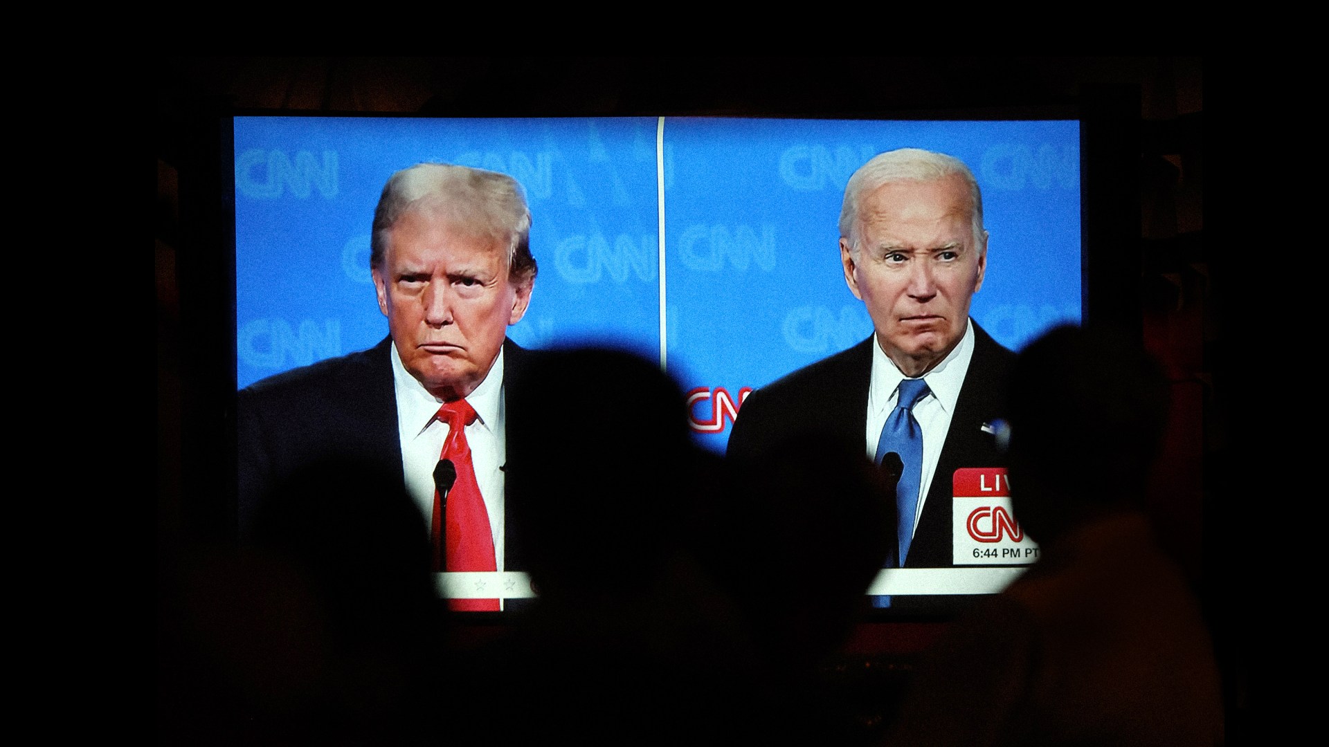 People watch the CNN presidential debate between US president Joe Biden and former president Donald Trump.