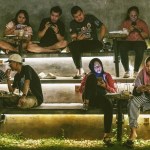 People use smartphones at a cafe in Jakarta, Indonesia.