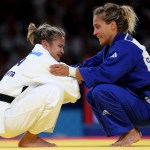 Odette Giuffrida of Italy (in blue) congratulates Larissa Pimenta of Brazil for winning the bronze medal in the women’s 52-kg Judo event. (See their story below, after the more recent posts.)