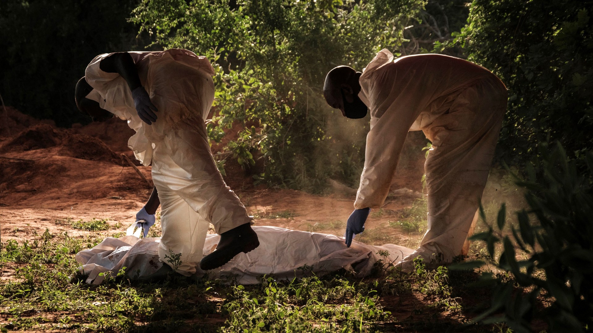 Bodies being exhumed at a mass-grave site linked to an investigation around a Kenyan cult that practiced starvation.