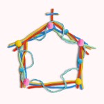 A church made of colorful pom-pom balls and pipe cleaners on a cream colored background