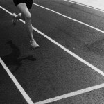 A runner crossing a finish line.