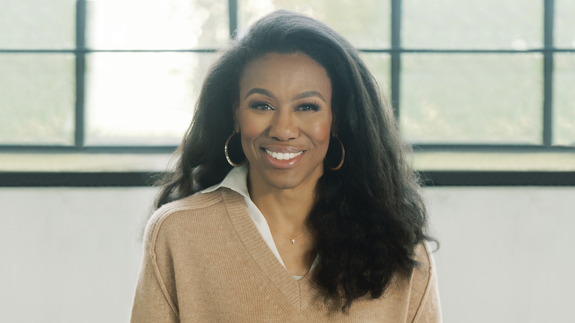 Priscilla Shirer in front of a window