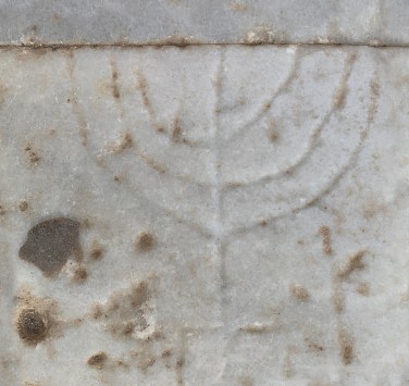 A Jewish lampstand on the step of Library of Celusus