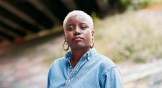 Headshot of Careese Dionne standing under an overpass