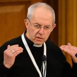 Archbishop of Canterbury Justin Welby speaks behind a microphone