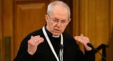 Archbishop of Canterbury Justin Welby speaks behind a microphone