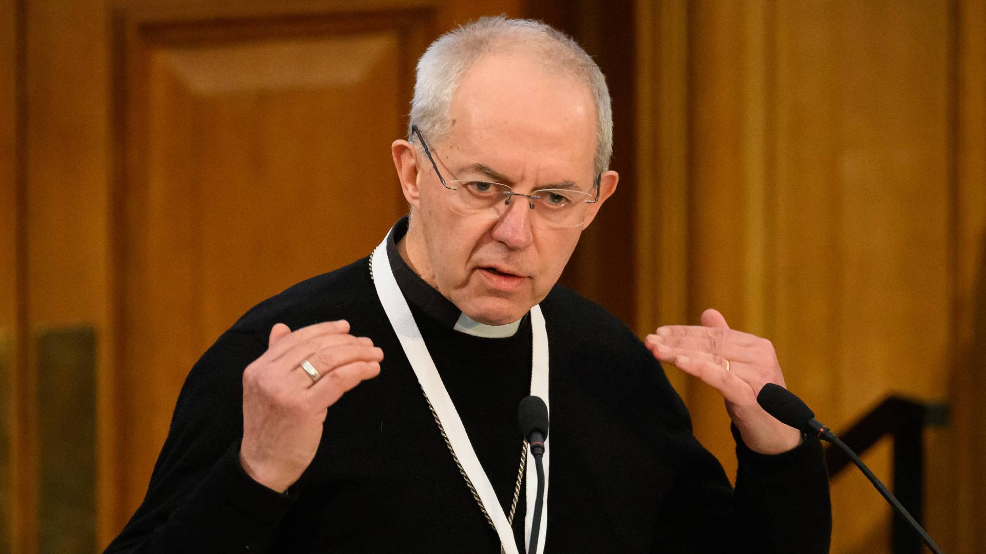 Archbishop of Canterbury Justin Welby speaks behind a microphone