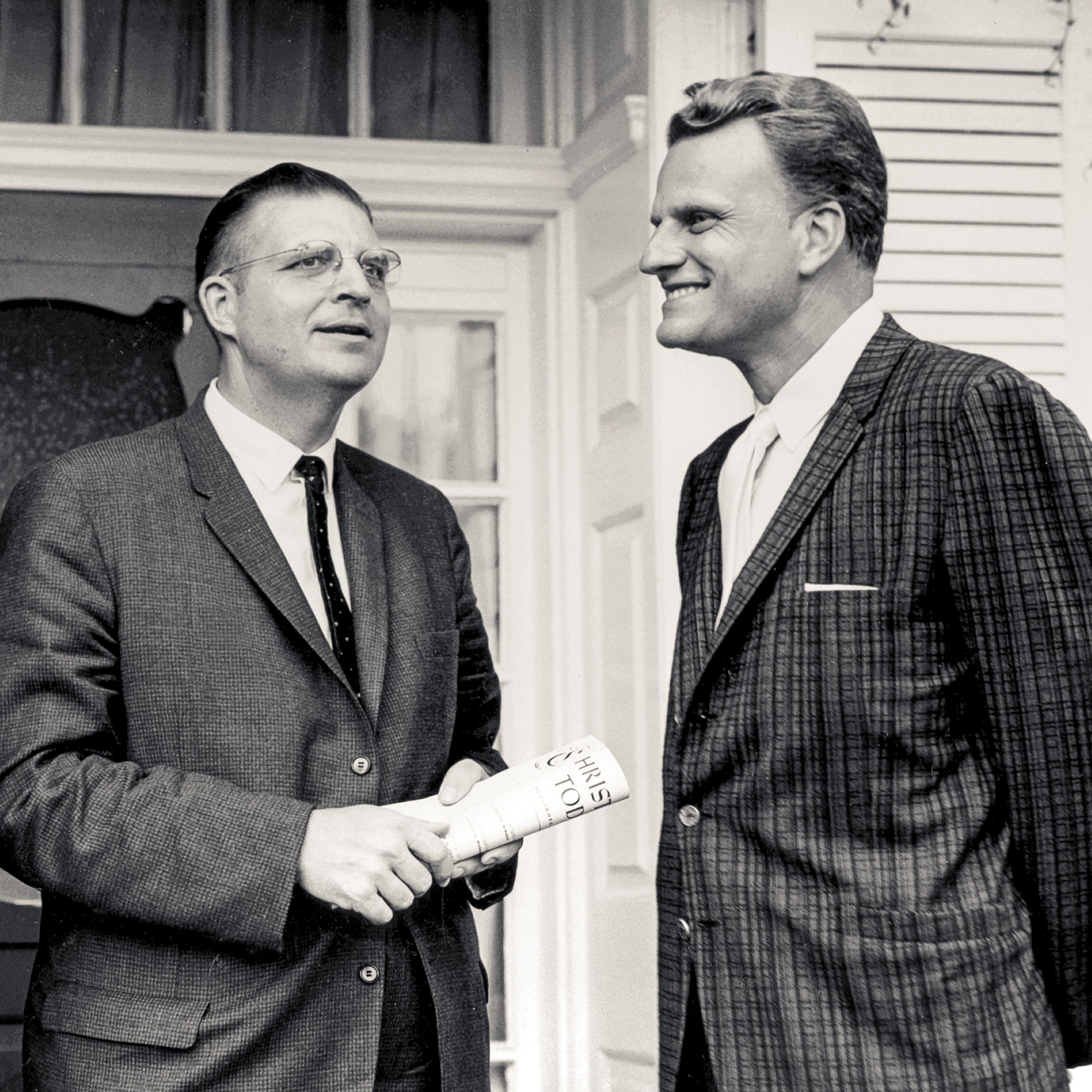 A photo of founder Billy Graham with Carl F.H. Henry, editor, who is holding the first issue of Christianity Today
