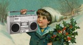 A boy carrying holly and a boombox