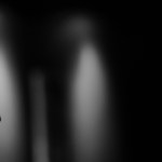 Photo of a man in prayer with head bowed and hands clasped