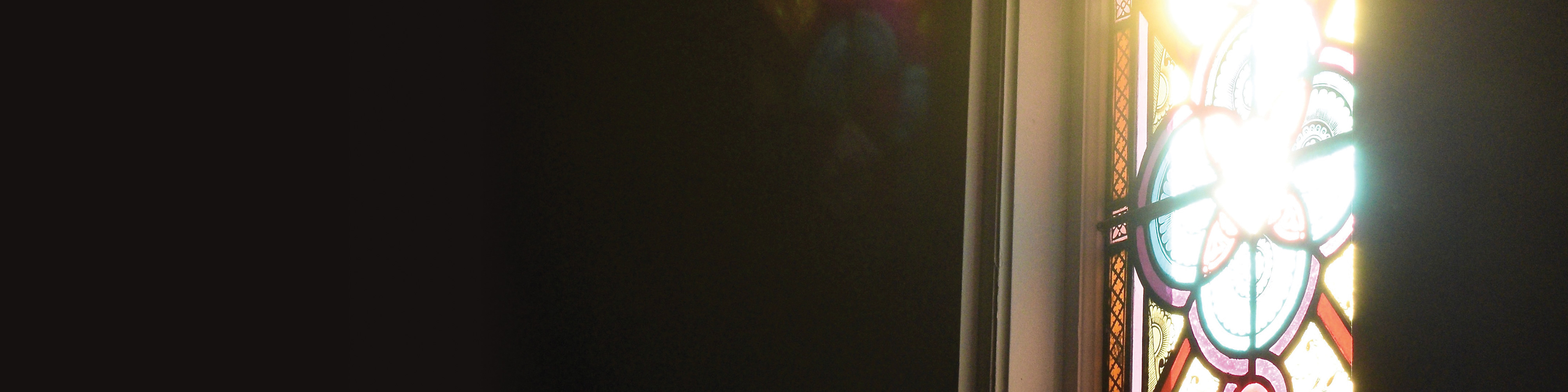 Photo of light coming through a stained glass window