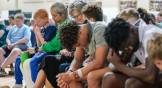 Attendees pray at Clayton Baptist Church