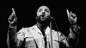 An image of Andraé Crouch performing.