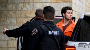 Suspected shooter Luigi Mangione is led into the Blair County Courthouse for an extradition hearing