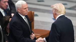 Mike Pence and Donald Trump shake hands at Jimmy Carter's funeral