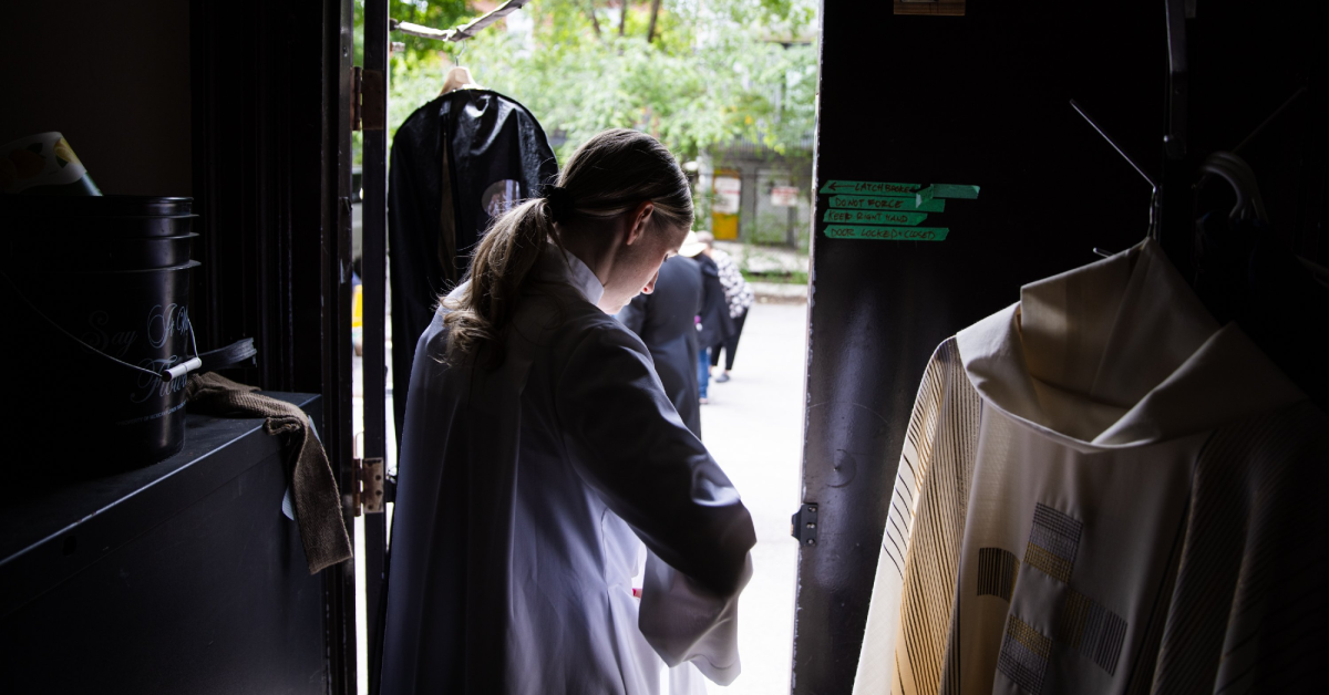 An Anglican minister prepares for worship in Canada