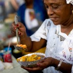 A woman prepares a dish of acaraje at the Ipanema fair, in Rio de Janeiro, Brazil.