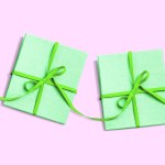 Several gifts set in a row with their ribbons connected.