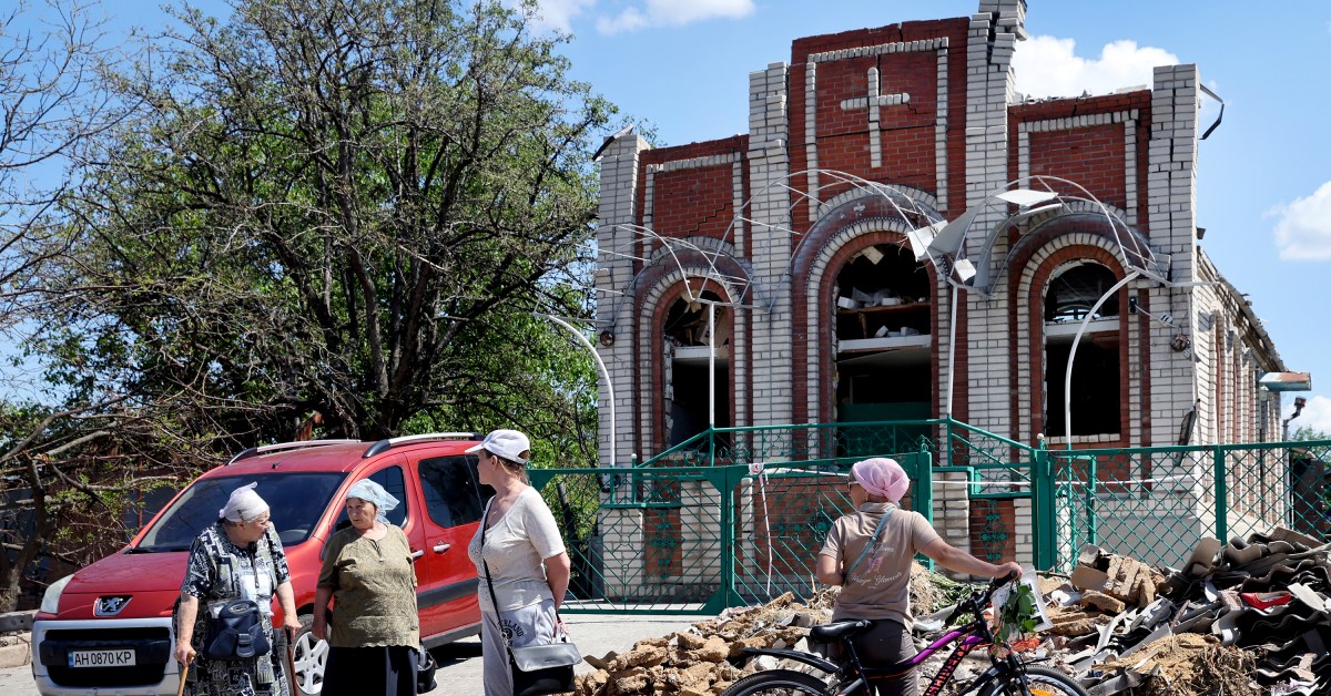 Worshippers leave Sunday service at Sukovska Baptist church in Ukraine.