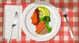 A plate full of vegetables and grains making the shape of a quarter.