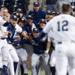 The Dallas Baptist University baseball team celebrates a walk-off win.