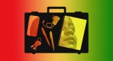 A briefcase with different objects in it showing the face of a woman