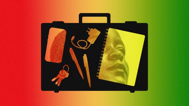 A briefcase with different objects in it showing the face of a woman