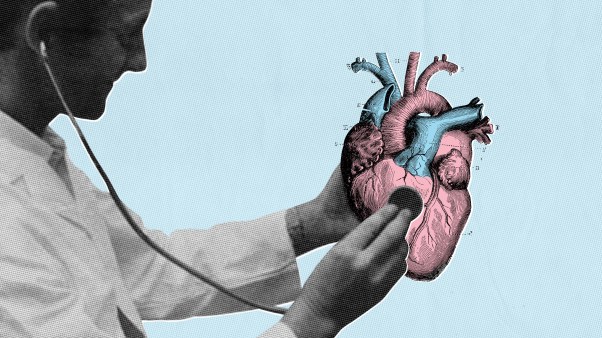 A doctor with a stethoscope on a heart