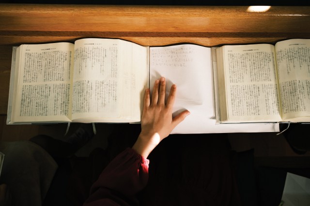 Hand on a bible in a church in Japan
