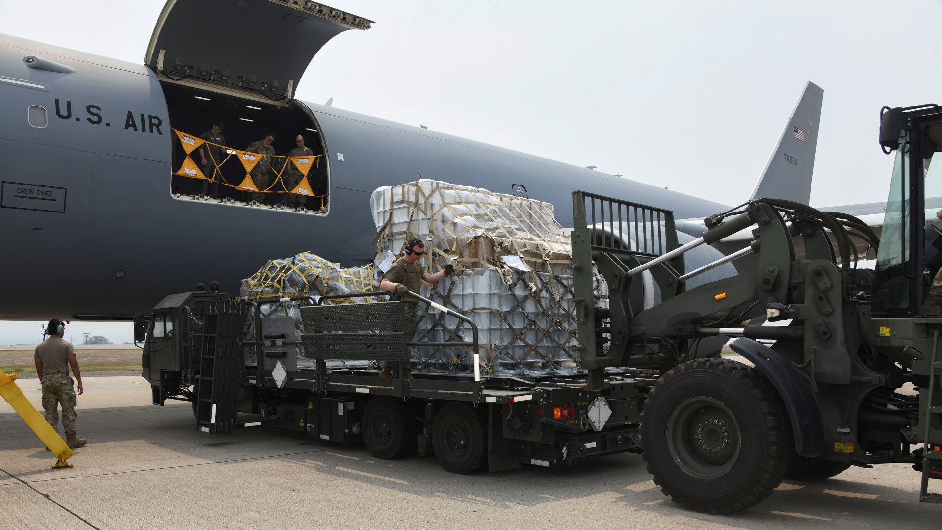 Airmen offload almost 26,000 pounds of cargo at Soto Cano Air Base in Honduras.