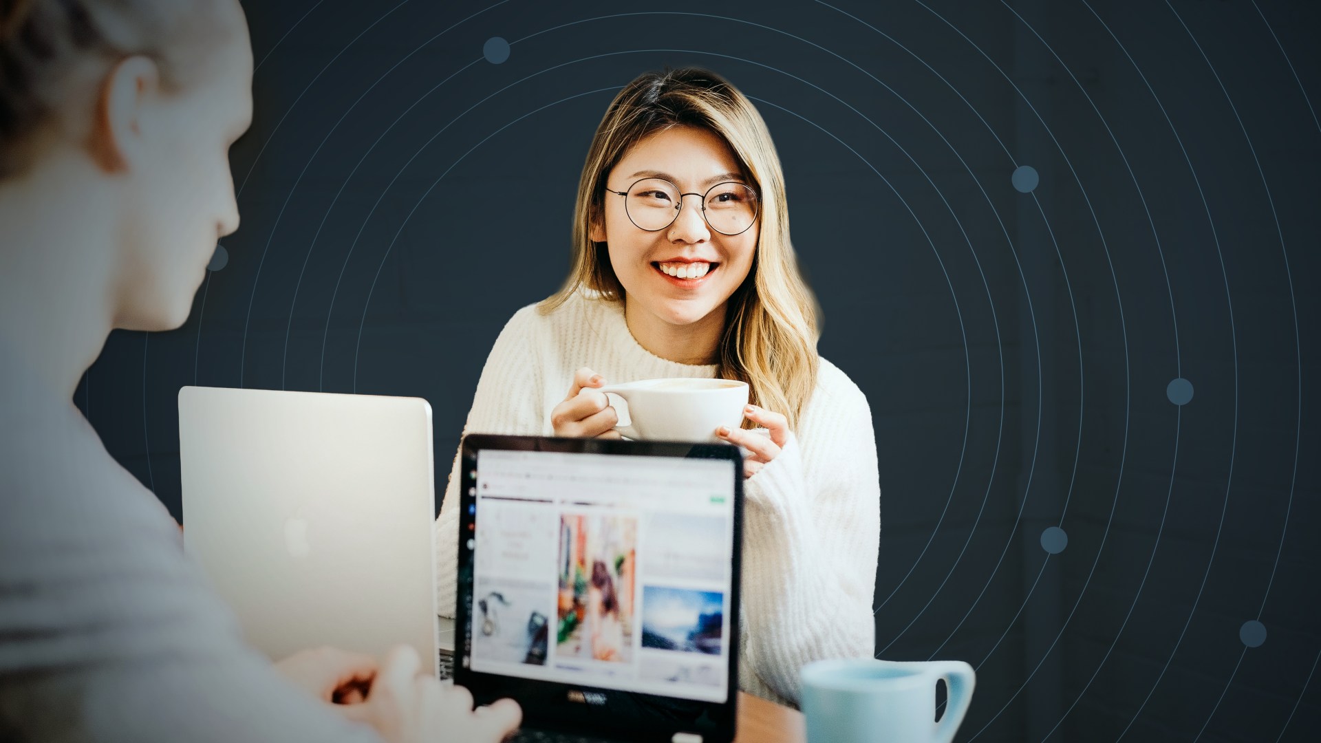 A woman sitting with a laptop