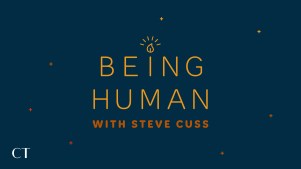 lit candle and star background