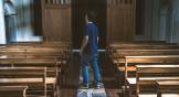man standing in empty church