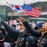 People taking part in a rally in Seoul, South Korea in support of impeached president Yoon Suk Yeol.