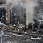 A woman and her dog walk on street in Kyiv after a Russian missile has destroyed the center of the city.