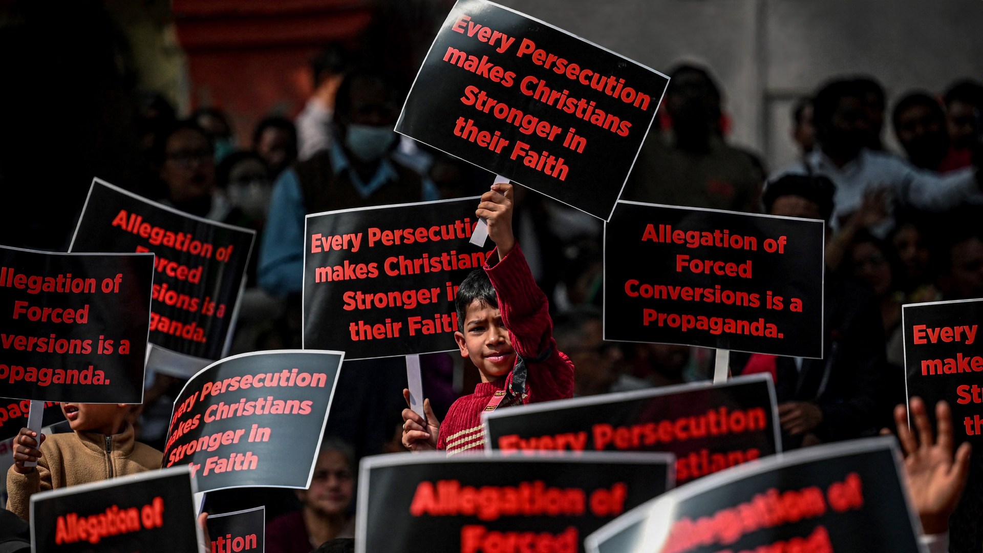 Christian activists display placards in a peaceful protest rally in New Delhi.