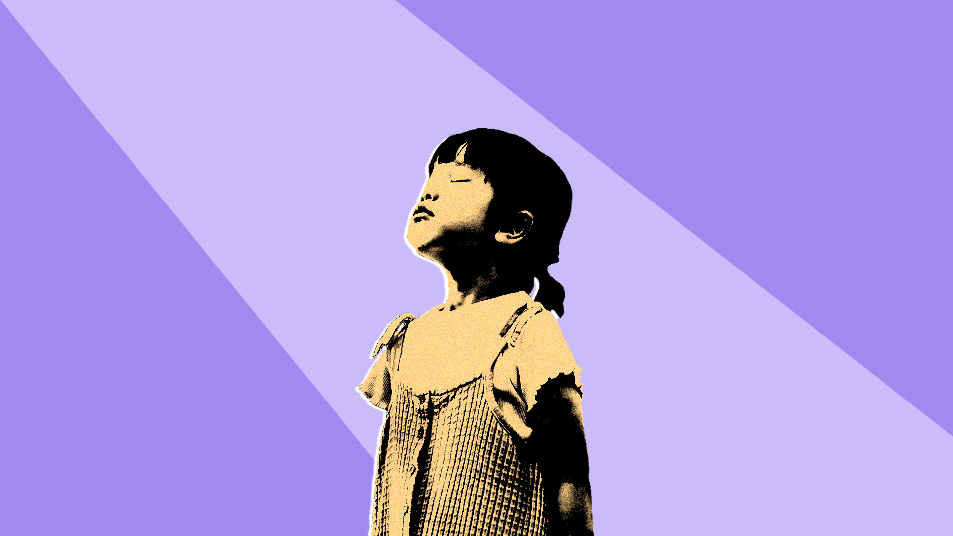 Young child looking up towards light on a purple background.