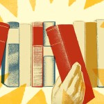 A hand pulling a book off of a shelf