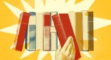 A hand pulling a book off of a shelf