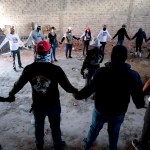 Members of Guerreros Buscadores pray at the Izaguirre Ranch where they located three human crematoriums while searching for their relatives in Mexico.