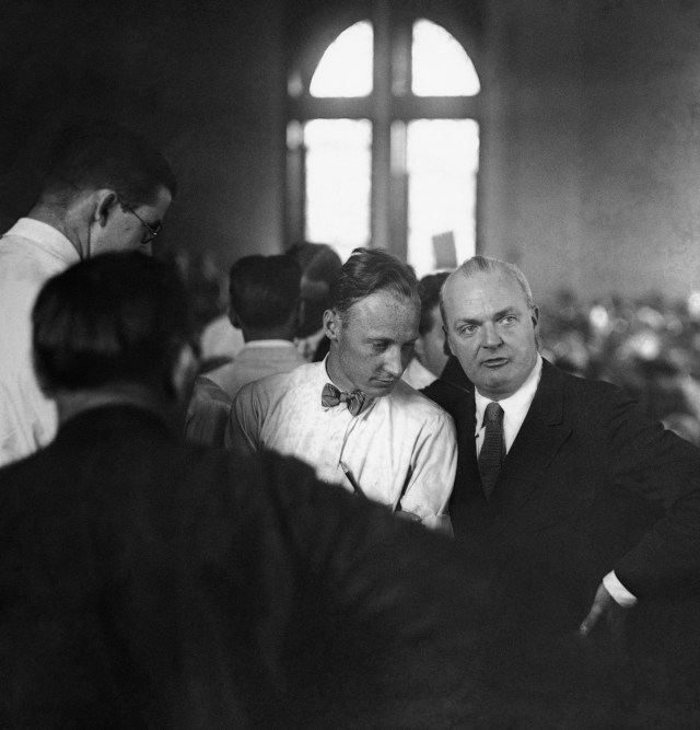 John Scopes, left, sits with Dudley Field Malone listening to the jury’s verdict.