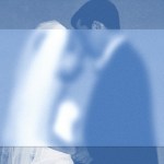A partially blurred image of a bride and groom exchanging vows.