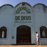 A woman walks before Sunday services at an evangelical church located in a partially deforested section of the Amazon rainforest in Brazil. 
