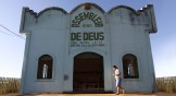 A woman walks before Sunday services at an evangelical church located in a partially deforested section of the Amazon rainforest in Brazil. 