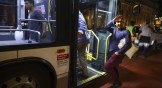 Migrants in Chicago board a bus to a downtown welcome center in August, 2022.