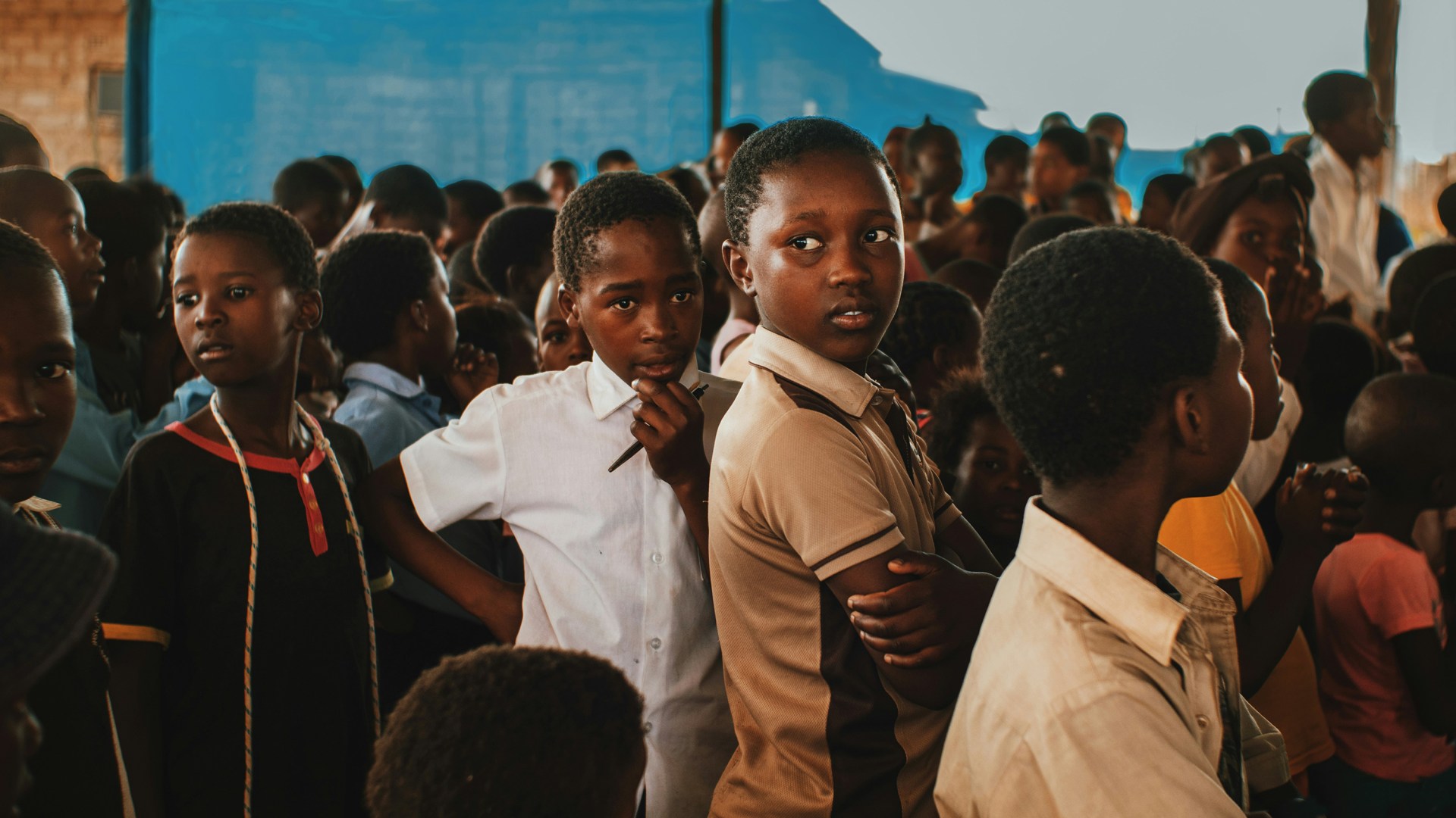 Nigerian children gathered in a building