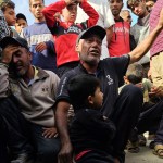 Relatives mourn after Israeli soldiers opened fire and killed Palestinians trying to reach US aid in Rafah.