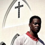 Chris Singleton standing in front of a church.